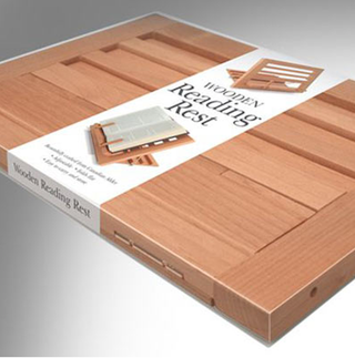 Illustration for article titled A Beautiful Wooden Book Rest for Old School Readers